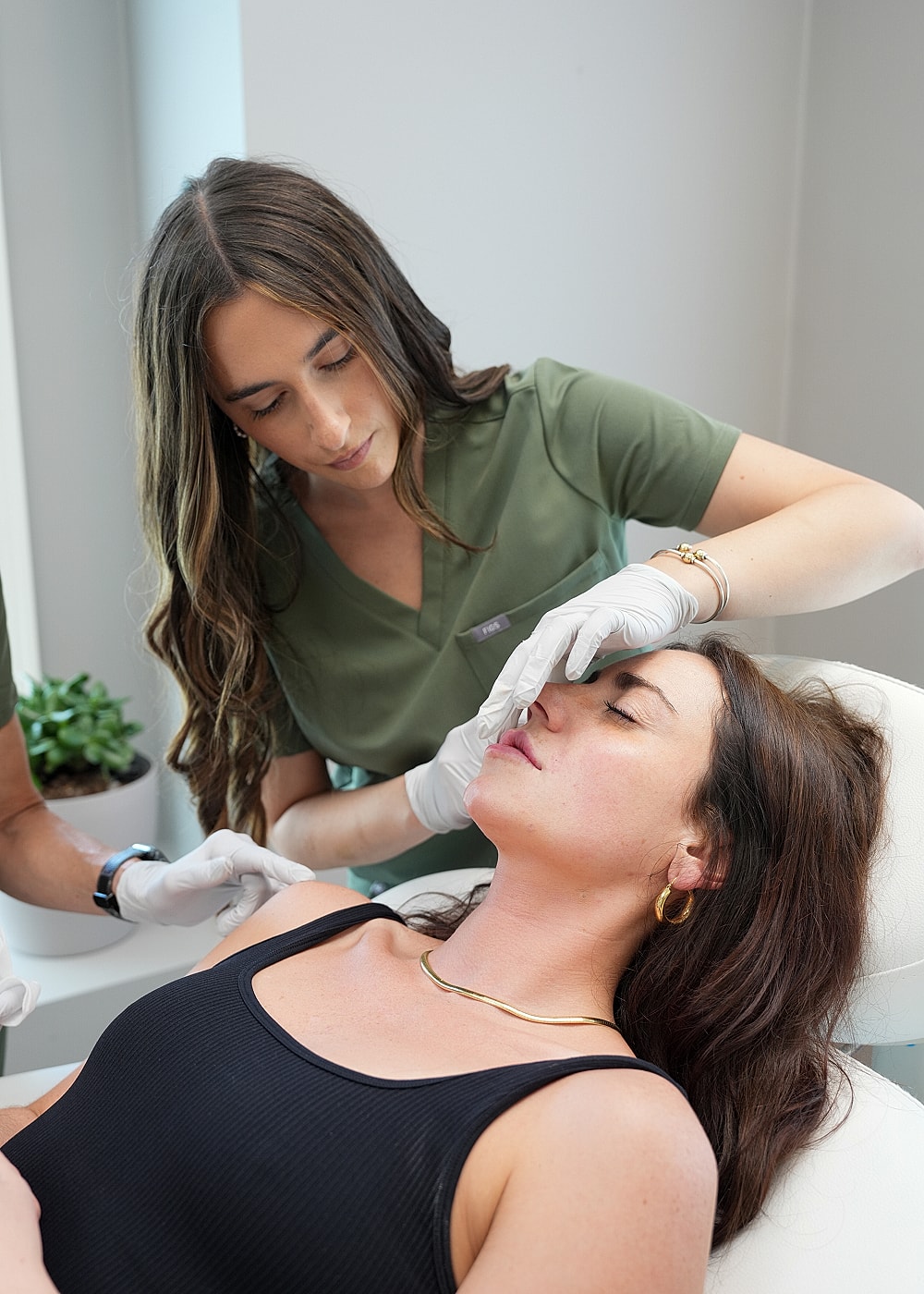 Cosmetic treatment session in a clinical setting.