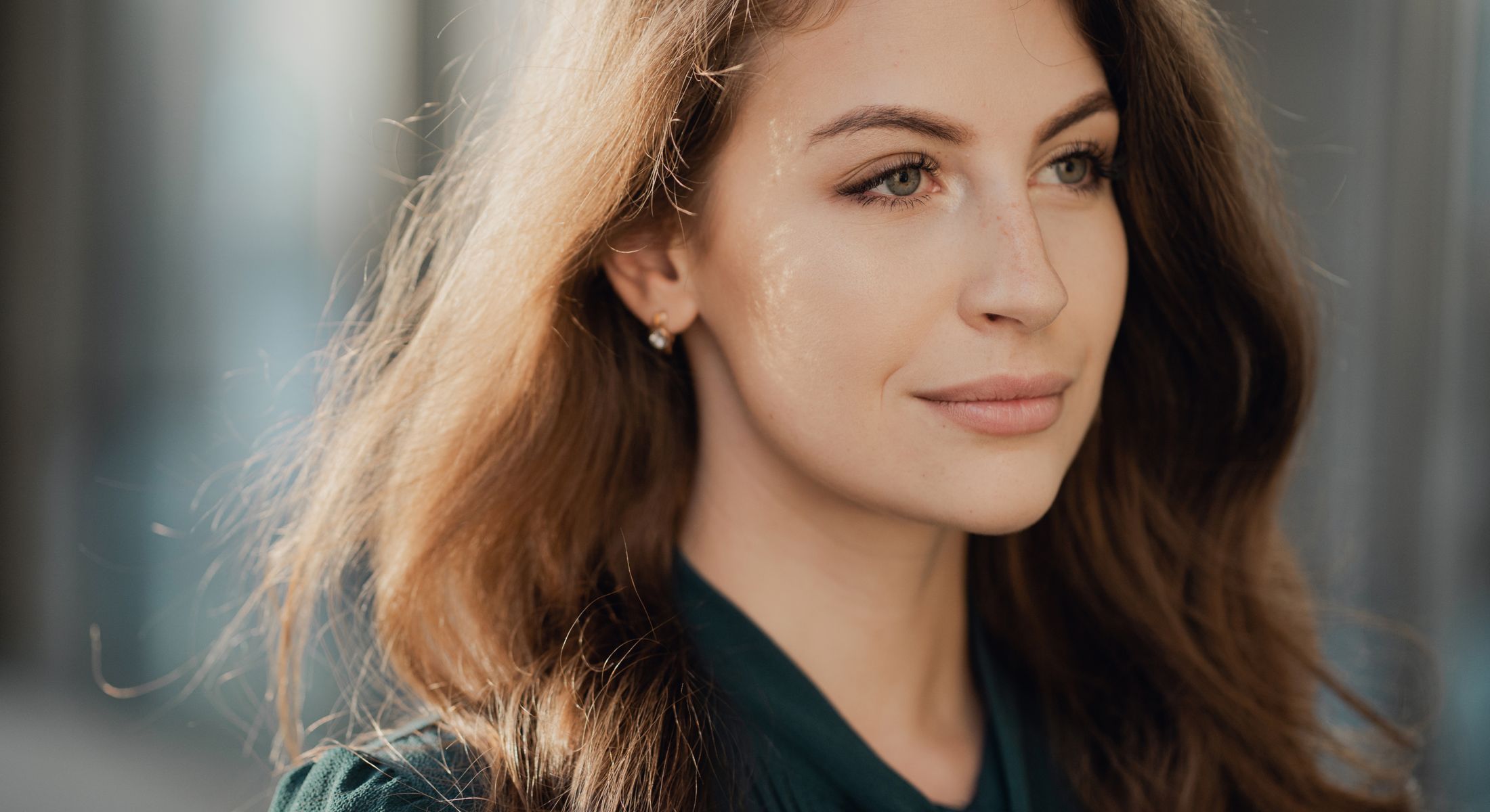 Woman with long hair in natural lighting.